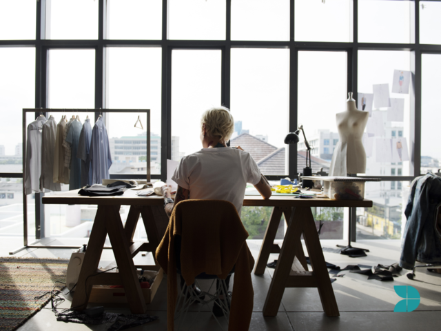 Fashion designer in their office working on their designs.