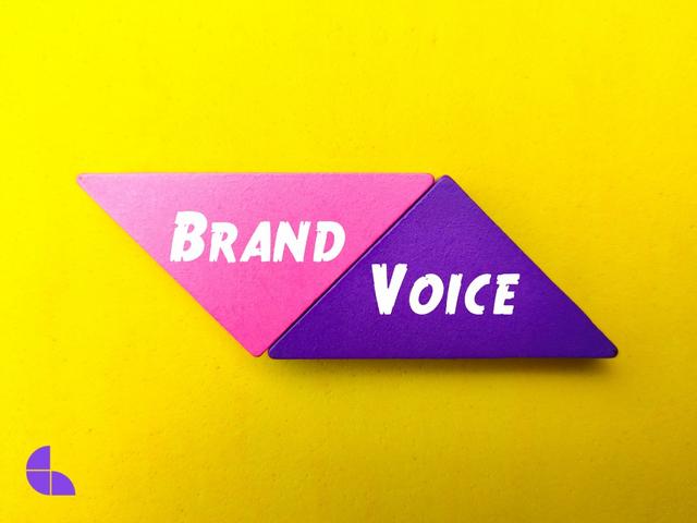 colored wooden block with word brand voice yellow background