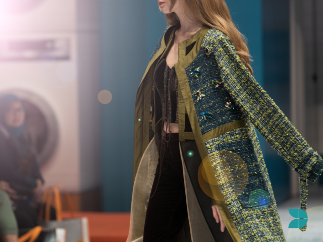 Fashion model walking in the runway with houte couture clothing.