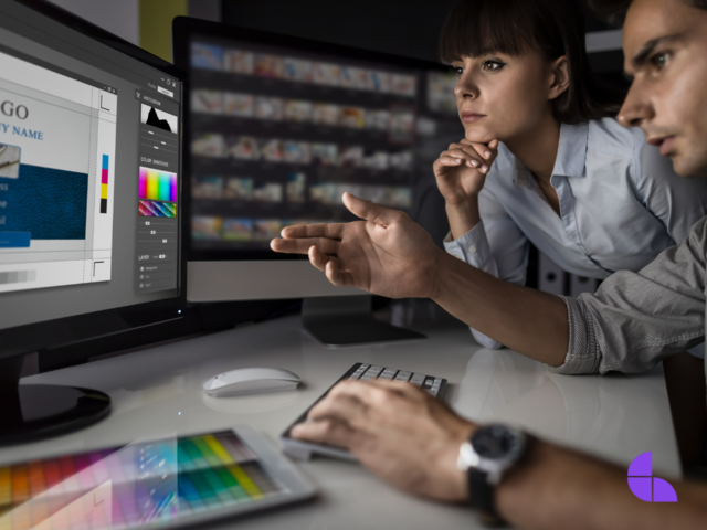 Two graphic designers collaborating in a logo design.